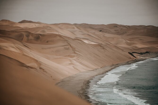 Sandwich Harbour 4x4 Guided Tour - Unforgettable Adventure - Sandwich Harbour: dunes into the Atlantic plus wine and snacks