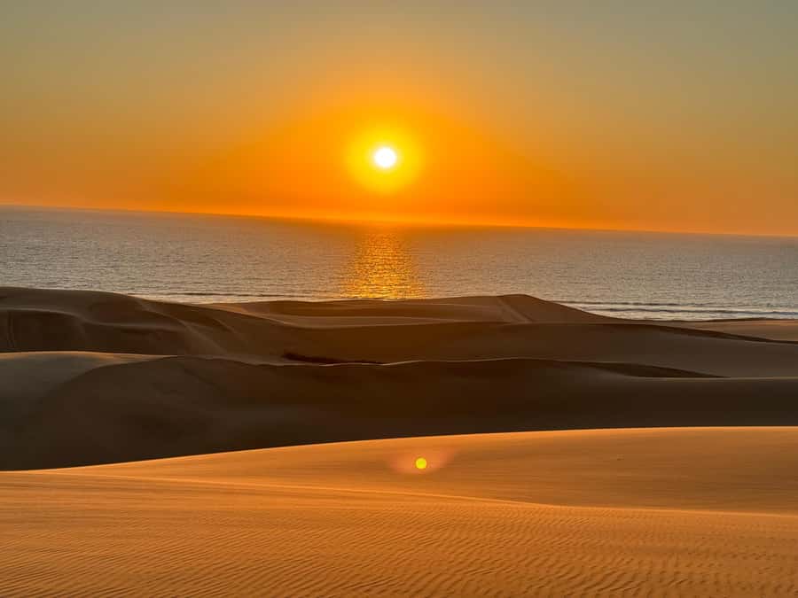 Walvisbay: Sandwich Harbour SUNSET Tour-End It Beautifully - From Flamingo Villas to flamingos in Walvis Bay Lagoon